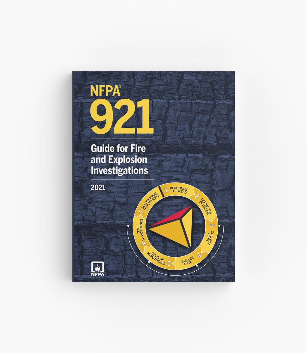 Product photo of 2021 NFPA 921 Guide for Fire and Explosion Investigations, lying flat with the front cover visible.